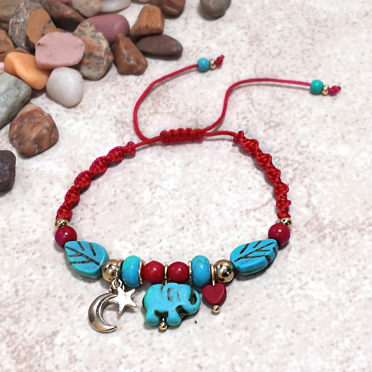 Elephant, moon, star and heart charm bracelet. Adjustable red bracelet.