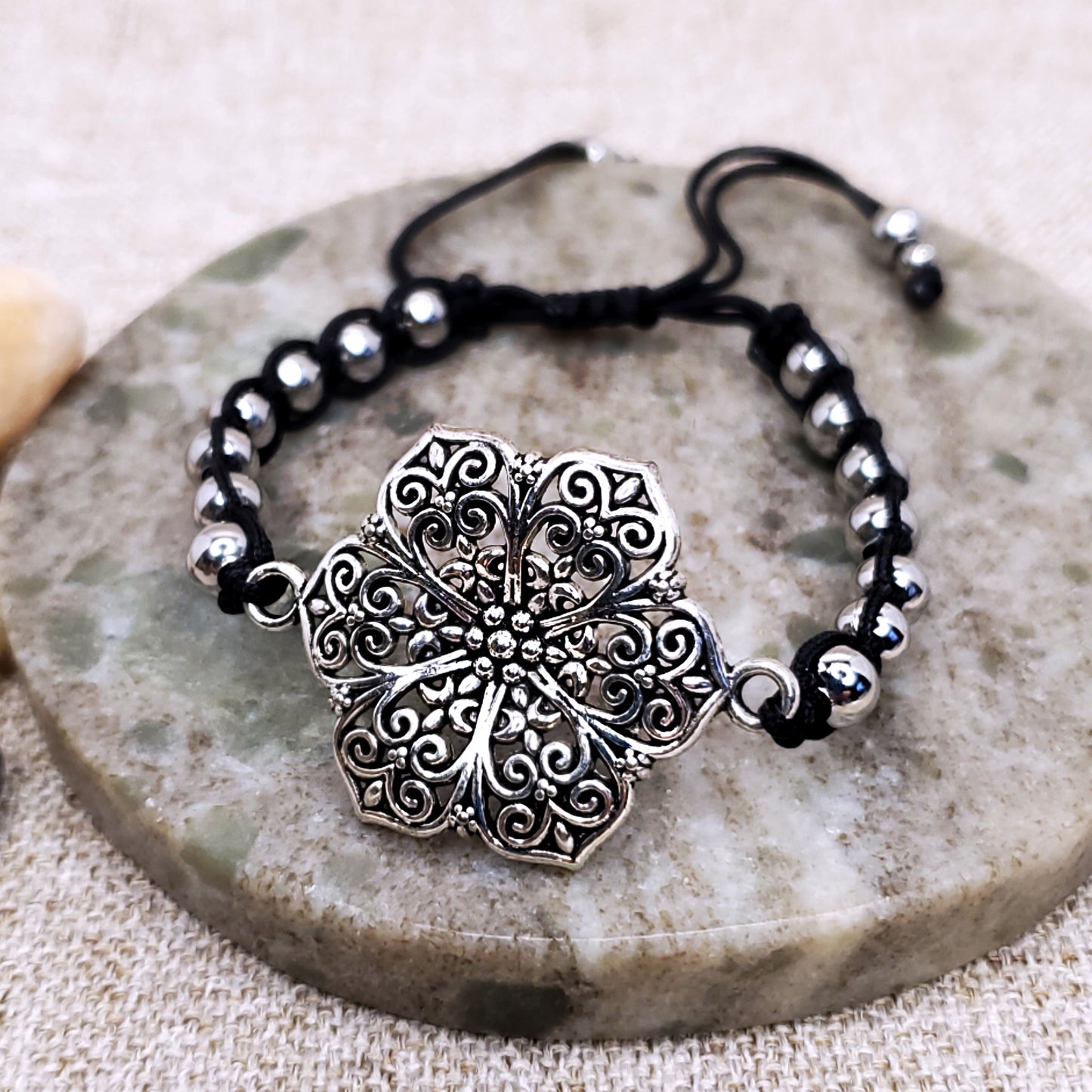 Silver flower adjustable black bracelet. One of a kind bracelet.