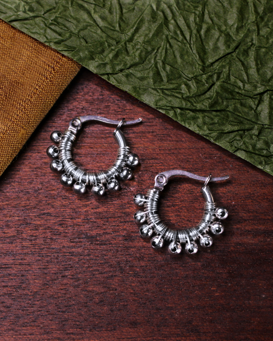 Mini hoop earrings silver hand wired with stainless steel beads. 