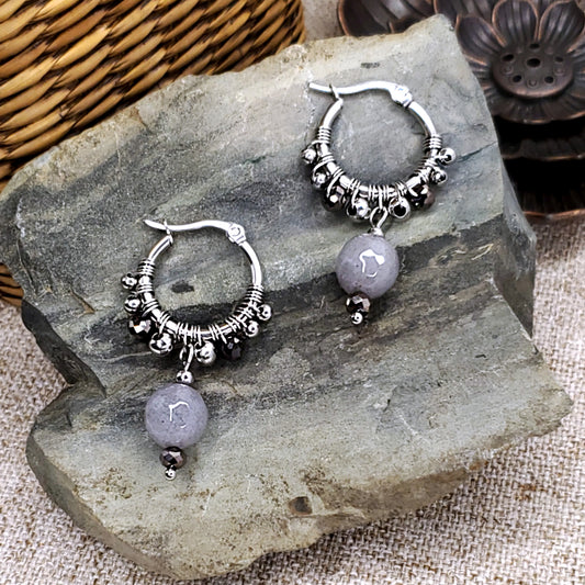 Stainless steel dangling earring hoops with gray jade beads.