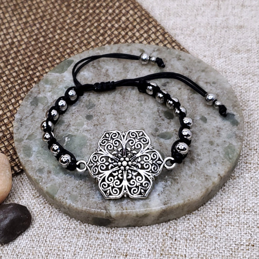 Silver flower adjustable black bracelet. One of a kind. 