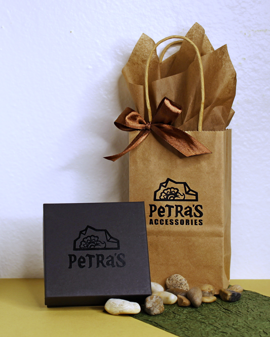 Jewelry giftwrap. Black jewelry box with PeTRa'S ACCESSORIES logo. Brown kraft bag with PeTRa'S ACCESSORIES logo. Brown satin bow and brown tissue paper. 