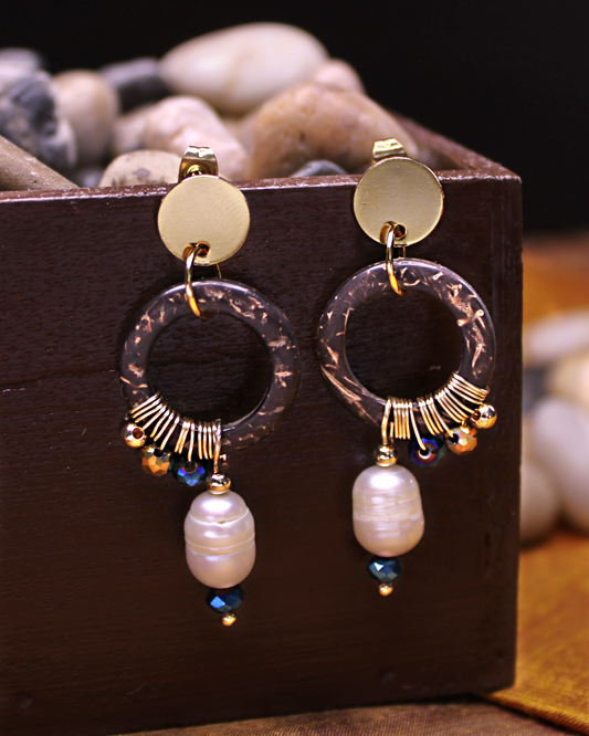 Gold plated stainless steel circle stud dangling earrings with coconut circle accent wired with blue, gold crystal beads and freshwater pearl. 