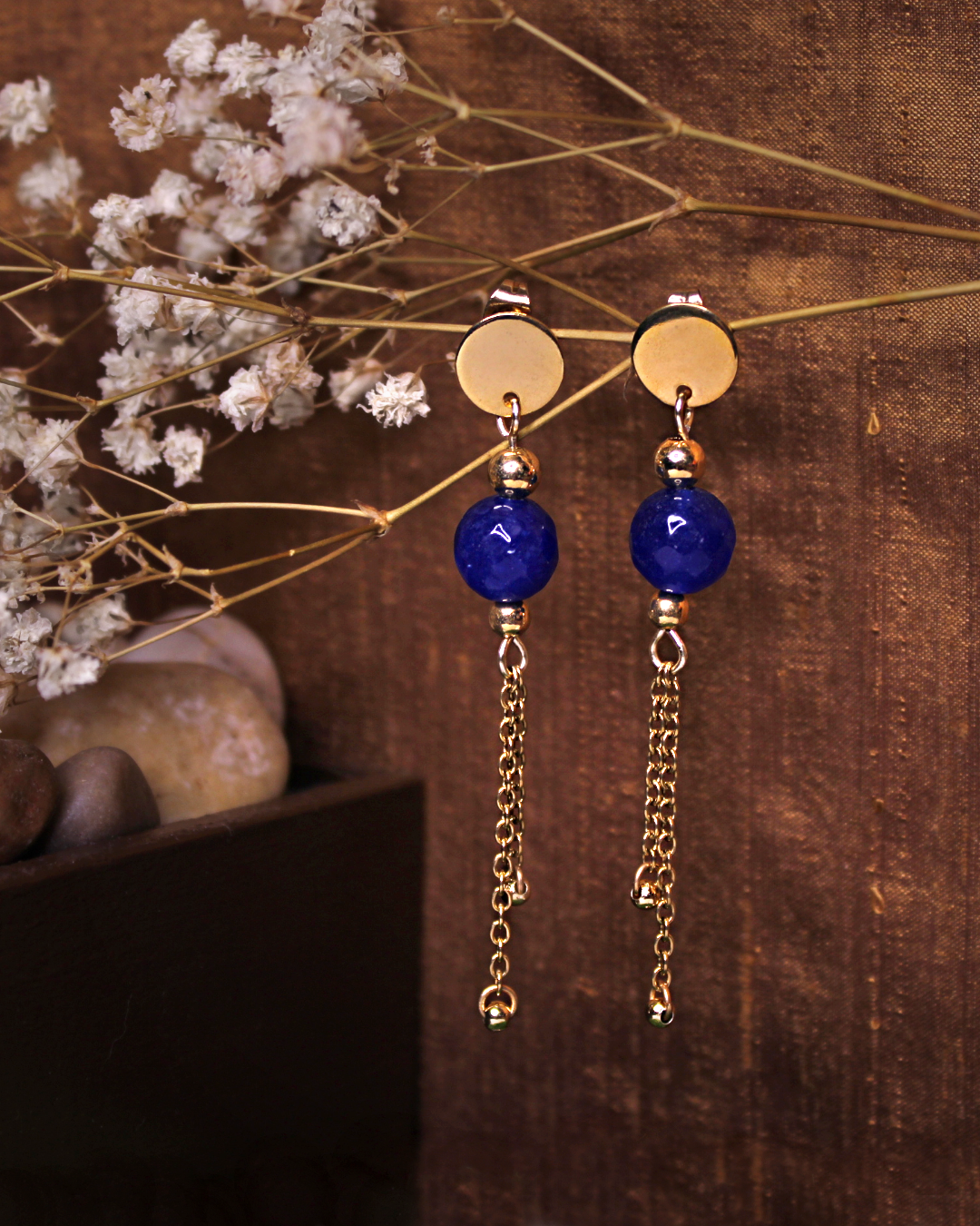 Gold plated stainless steel circle stud earrings with faceted dark blue jade bead and gold plated chain accent.