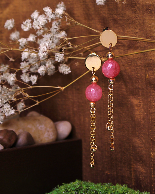 Gold plated stainless steel circle stud earrings with faceted pink jade bead and gold plated chain accent.